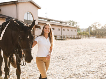 Beautiful woman with horse in countryside