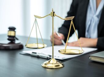 Female lawyer working with legal case document contract in offic